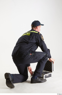 Sam Atkins Fireman Pose with Case kneeling whole body 0011.jpg